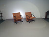 2 post-modern T-line armchairs