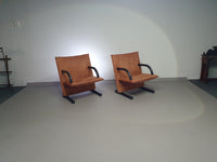 2 post-modern T-line armchairs