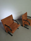 2 post-modern T-line armchairs