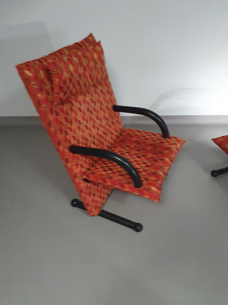 2 post modern t-line armchairs