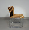 Stacking wicker, rattan chairs (4) model S.21 on a chromed steel structure. Designed by Tito Agnoli