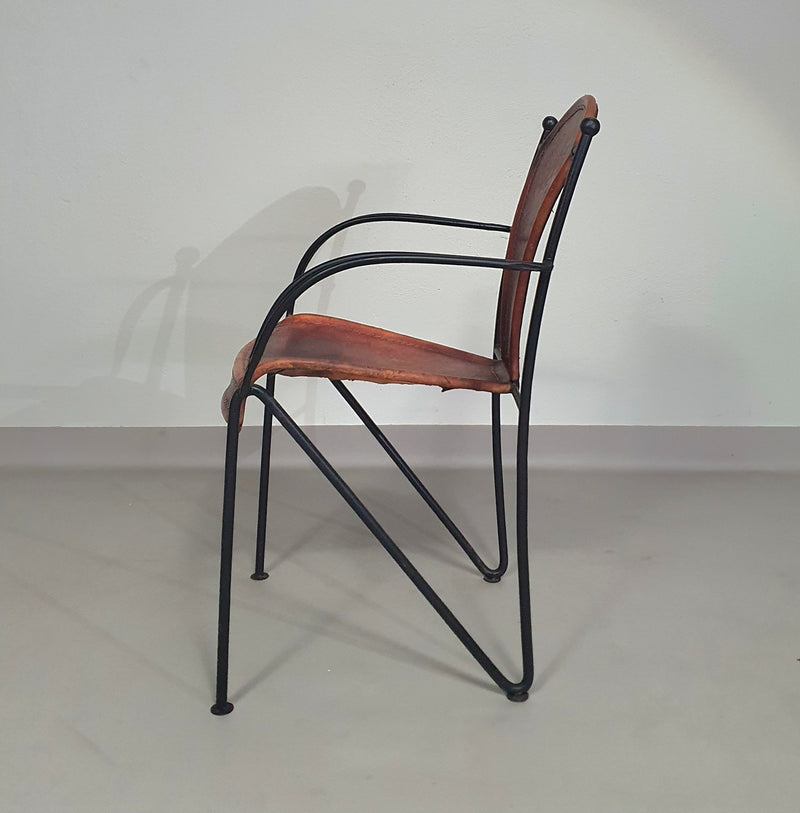 24 chairs in leather and solid wrought iron