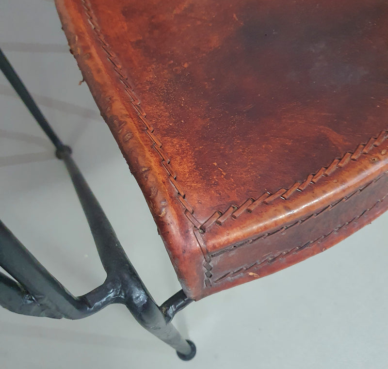 24 chairs in leather and solid wrought iron