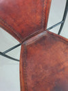 24 chairs in leather and solid wrought iron