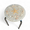 Stools with a decorative top made with sand , seashells, and a starfish embedded in a clear acrylic / 1970s