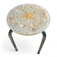 Stools with a decorative top made with sand , seashells, and a starfish embedded in a clear acrylic / 1970s