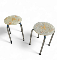 Stools with a decorative top made with sand , seashells, and a starfish embedded in a clear acrylic / 1970s