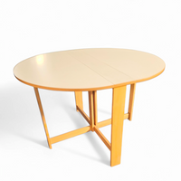 Vintage scandinavian folding dining table with side leaves. The oval top is made of white formica