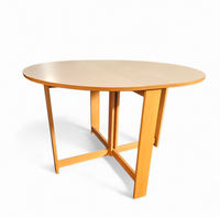 Vintage scandinavian folding dining table with side leaves. The oval top is made of white formica