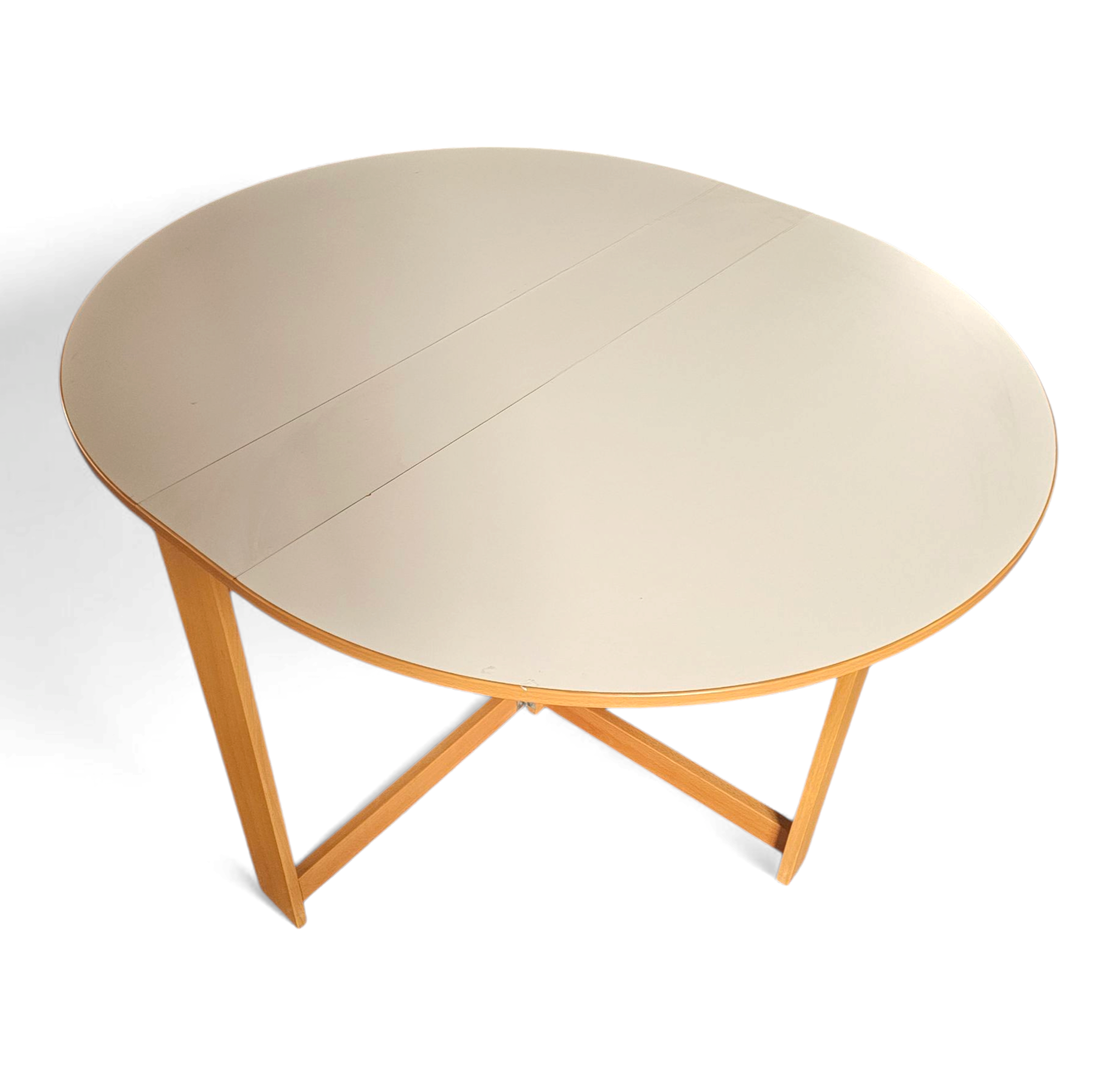 Vintage scandinavian folding dining table with side leaves. The oval top is made of white formica