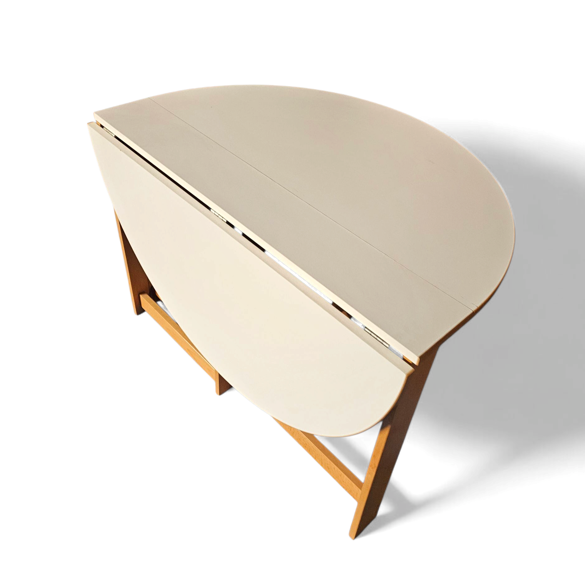 Vintage scandinavian folding dining table with side leaves. The oval top is made of white formica