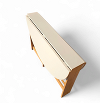 Vintage scandinavian folding dining table with side leaves. The oval top is made of white formica