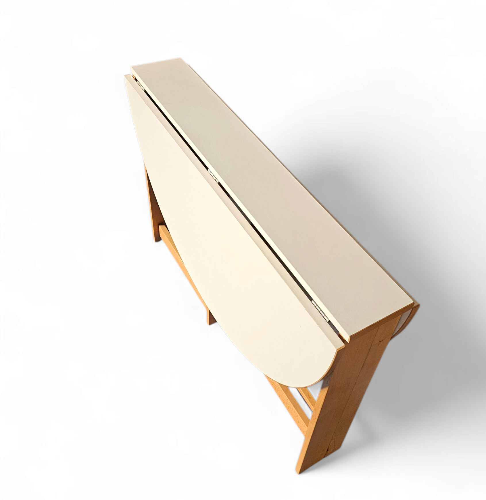 Vintage scandinavian folding dining table with side leaves. The oval top is made of white formica