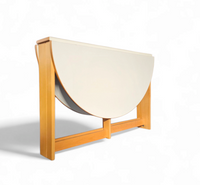 Vintage scandinavian folding dining table with side leaves. The oval top is made of white formica