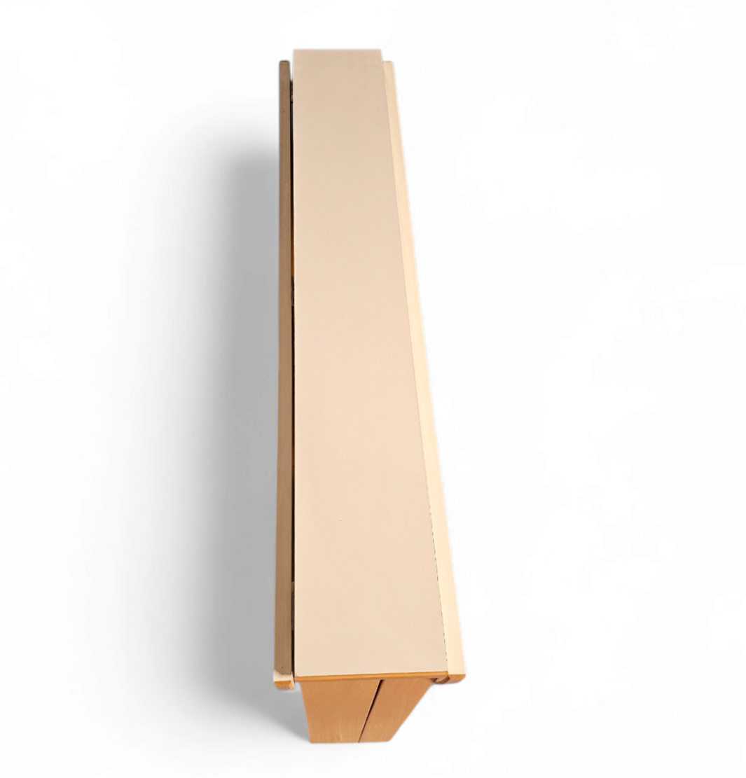 Vintage scandinavian folding dining table with side leaves. The oval top is made of white formica