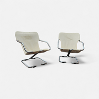 2 x Tubular chrome cantilever chair with a cream canvas sling