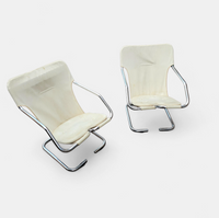 2 x Tubular chrome cantilever chair with a cream canvas sling