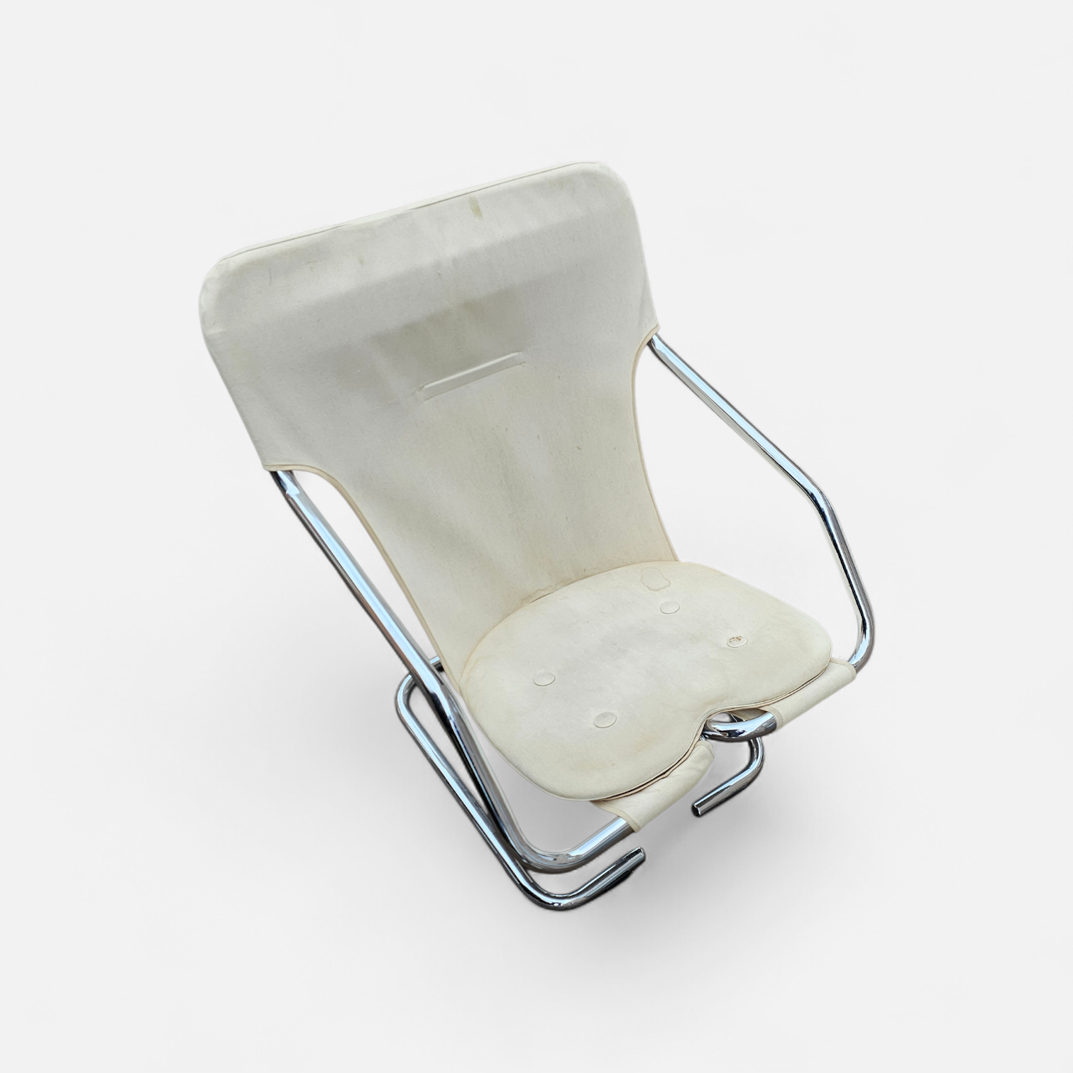 2 x Tubular chrome cantilever chair with a cream canvas sling