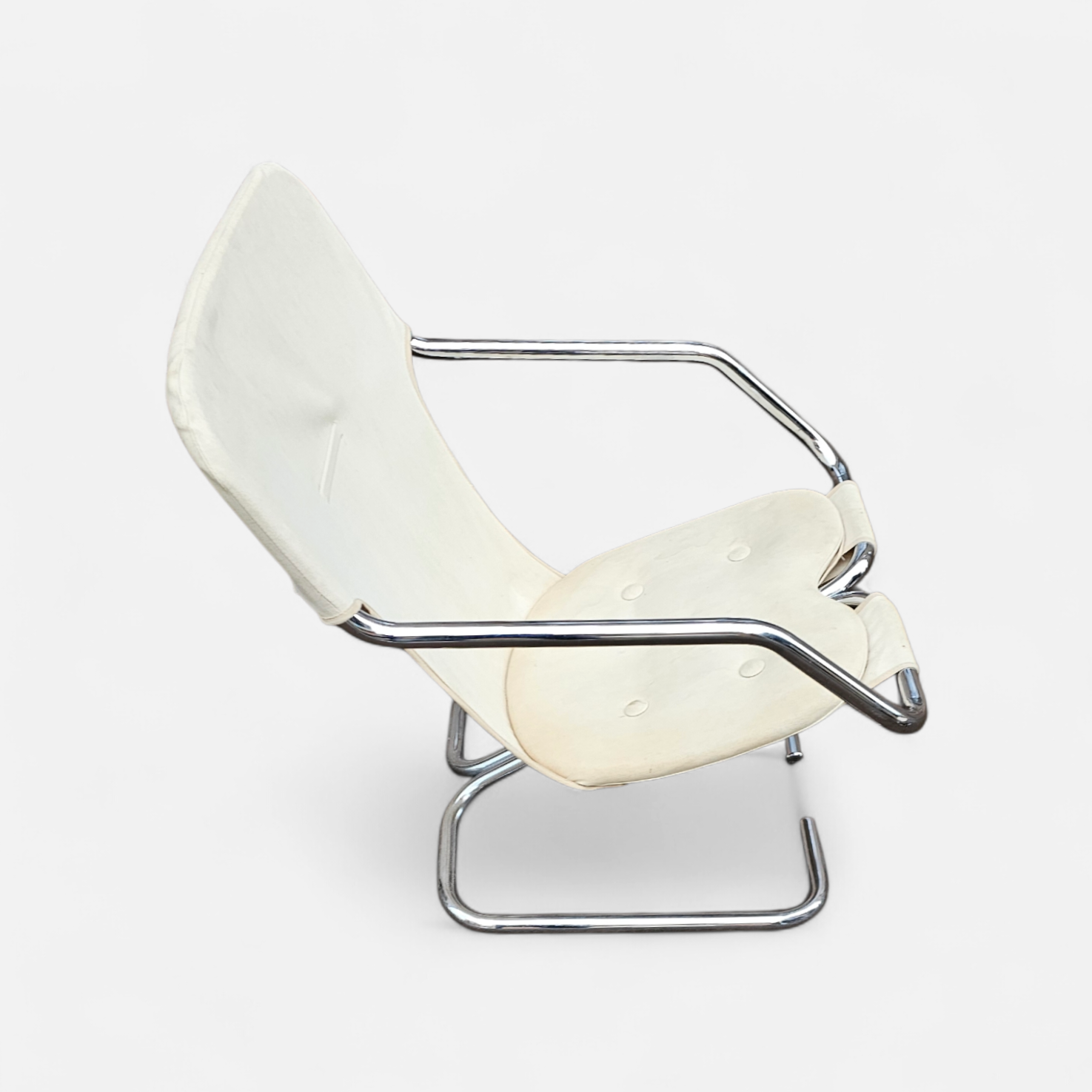 2 x Tubular chrome cantilever chair with a cream canvas sling