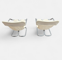 2 x Tubular chrome cantilever chair with a cream canvas sling