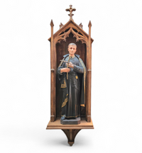 Statue of a religious figure / Patron Saint Gerard Majella / placed in a Gothic niche / labeled /