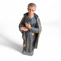 Statue of a religious figure / Patron Saint Gerard Majella / placed in a Gothic niche / labeled /