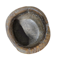 A substantial hand-hewn wooden bowl carved from a single burl section