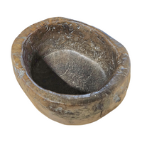 A substantial hand-hewn wooden bowl carved from a single burl section