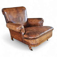 Beautiful and stately old English sheep leather club chair with armrests