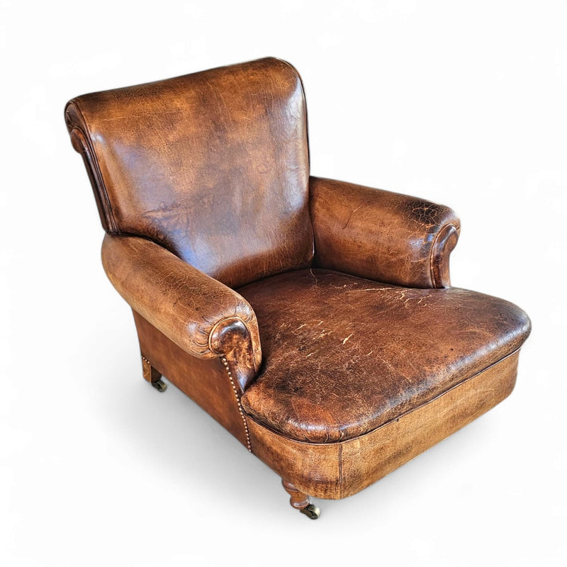 Beautiful and stately old English sheep leather club chair with armrests
