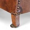 Beautiful and stately old English sheep leather club chair with armrests