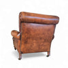 Beautiful and stately old English sheep leather club chair with armrests