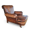 Beautiful and stately old English sheep leather club chair with armrests