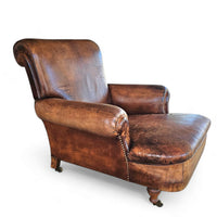 Beautiful and stately old English sheep leather club chair with armrests