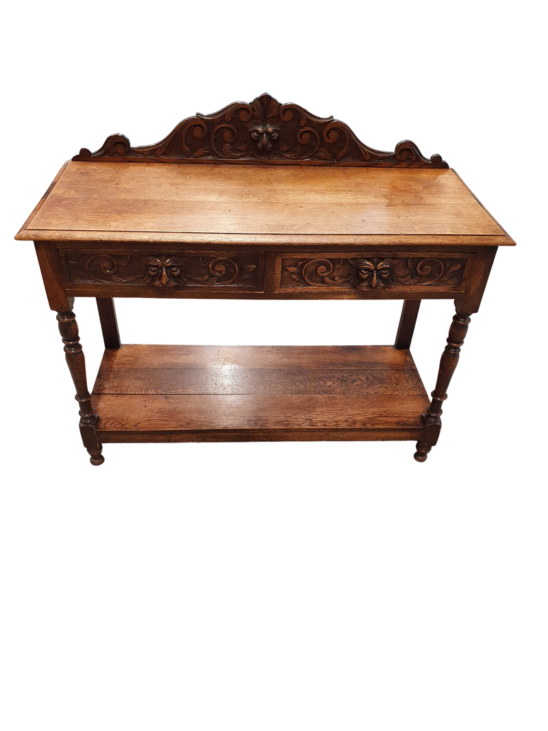 Victorian Gothic Oak side table, decorative carved round 1920. Green Mask decoration