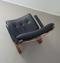 2 x Scandinavian black leather lounge chairs