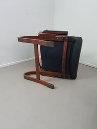 2 x Scandinavian black leather lounge chairs