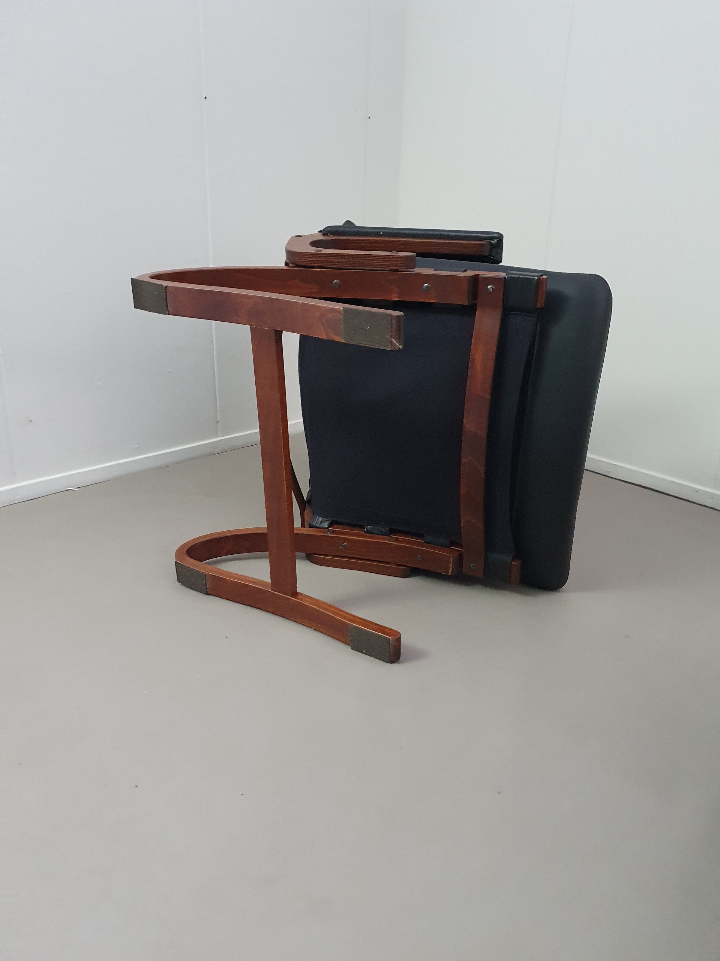 2 x Scandinavian black leather lounge chairs